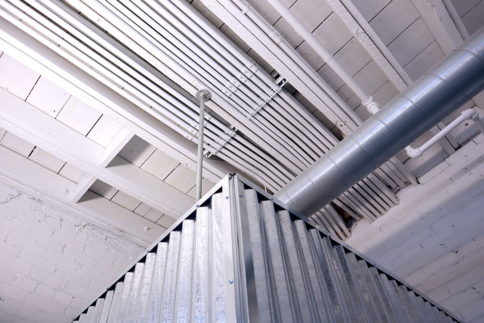 Custom industrial wall panels installed inside shared warehouse environment