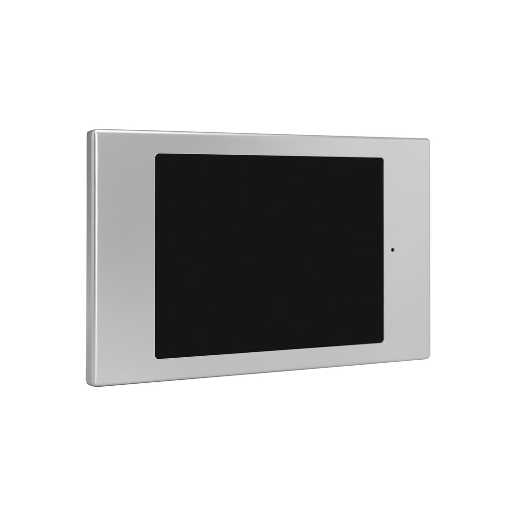 A black wall mount for iPad Mini Gen 4/5, made of aluminum, mounted on a white wall.